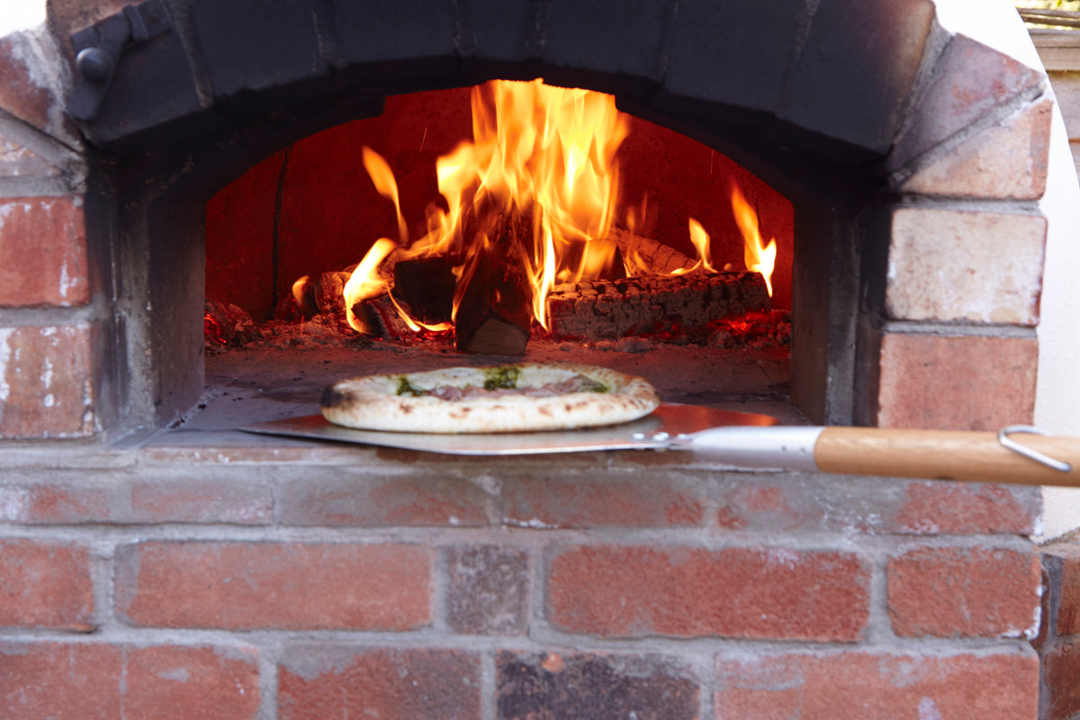 the-best-way-to-cook-a-pizza-in-a-wood-fired-oven-logpile